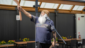 Ngarrindjeri and Kaurna Elder, Major Sumner AM, offers a Welcome to Country in the courtyard of the refurbished Hutt St Centre.